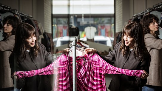 Second hand clothing store Goodbyes co-Founders Olivia Mangan and Monique Thomas check the quality of some of the pieces in their Collingwood store.