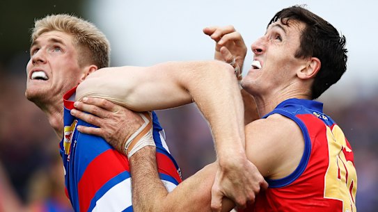 Bulldog Tim English battles with Lion Oscar McInerney.