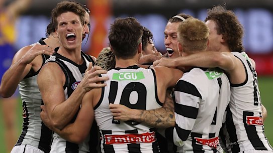 Collingwood celebrate a famous win against West Coast.