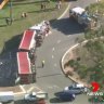 B-Double rolls on Brisbane roundabout, spilling rubbish everywhere
