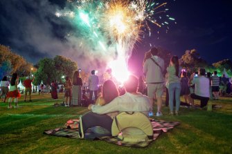 Families celebrating New Year’s Eve in Melbourne’s Alexander Gardens. 