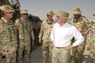 John Howard in 2005 meeting Australian troops in Iraq. 