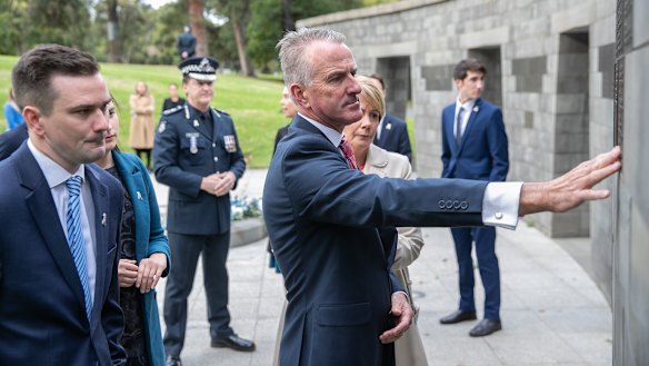 Josh Prestney’s father, mother and brother at the police memorial.