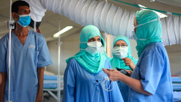 Red Cross staff inside a new field hospital for coronavirus patients in the southern city of Aden. 