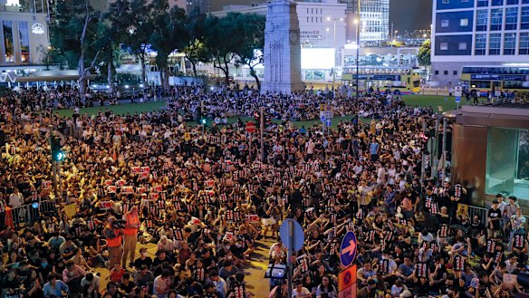 Pro-democracy protesters gather to participate in a rally organised by higher education students in Chater Garden in Hong Kong.
