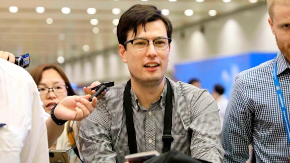 Australian student Alek Sigley arriving at the airport in Beijing after be was released from North Korea in July last year.