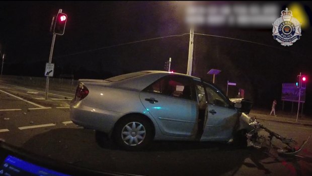 The innocent driver's car was a wreck after the impact in the middle of the intersection.