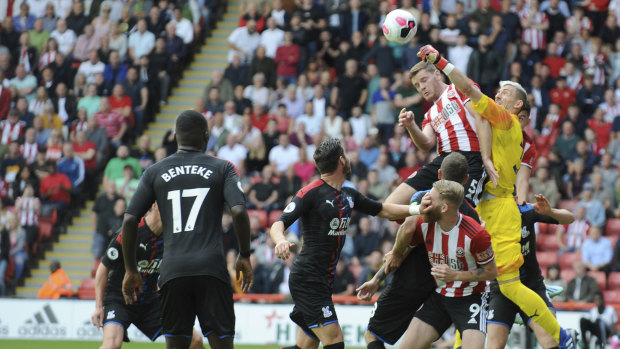 Palace goalkeeper Vicente Guaita punches the ball to keep Sheffield United out at Bramall Lane in Sheffield on Sunday.