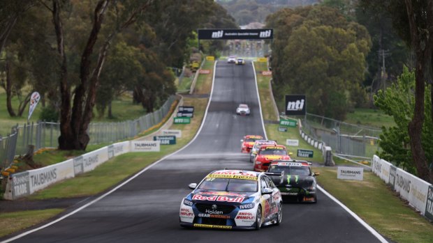Straight and narrow: Holden driver leads the field down the famous Conrod Straight at Mount Panorama.
