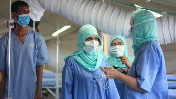 Red Cross staff inside a new field hospital for coronavirus patients in the southern city of Aden. 
