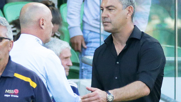 Fair play: Melbourne Victory coach Kevin Muscat shakes hands with Wellington Phoenix boss Mark Rudan after the 3-3 draw at AAMI Park.