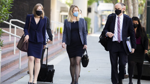 Theranos founder Elizabeth Holmes (centre) attends a court hearing last week. 