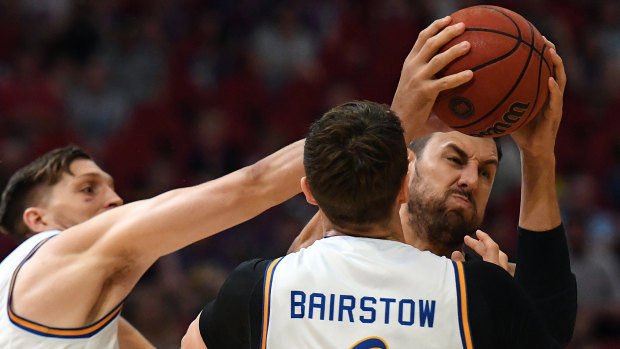 Numbering up: The Bullets try and smother Andrew Bogut at Qudos Bank Arena.