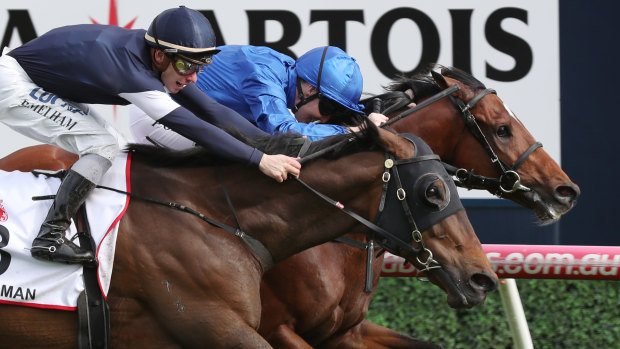 Best Solution (right) holds off Homesman to win the Caulfield Cup.
