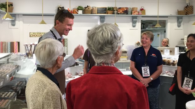 Gerrard Gosens spoke to a food tour group that came to his shop on Tuesday.