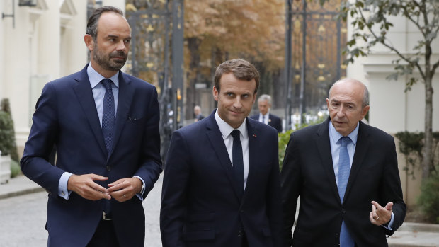 Emmanuel Macron, centre, French Interior Minister Gerard Collomb, right, and Prime Minister Edouard Philippe last year.