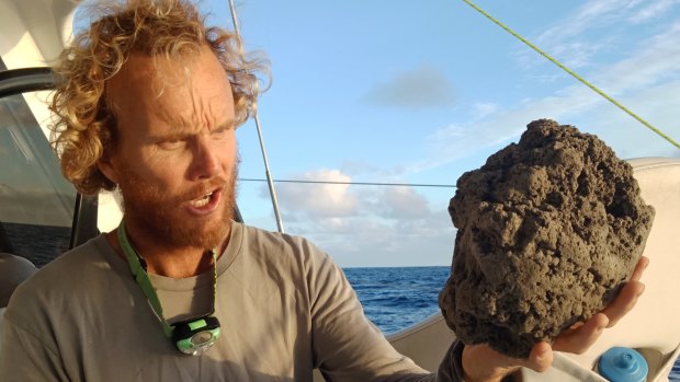 Mick Hoult with a sample of the pumice he encountered sailing to Fiji.