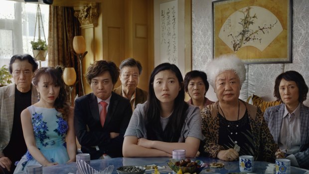 Awkwafina (centre) plays a woman railing against a family lie in The Farewell.