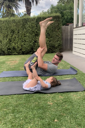 Jenkins does yoga with daughter Lottie.