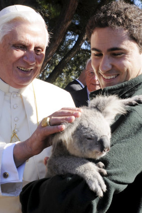 Pope Benedict XVI pets a koala at the Kenthurst Study Centre in Sydney, Australia on July 16, 2008. 