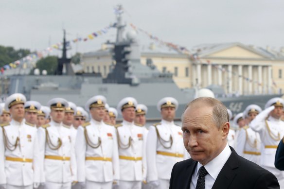 Russian President Vladimir Putin arrives to attend the military parade during the Navy Day celebration in St. Petersburg, Russia in 2017.