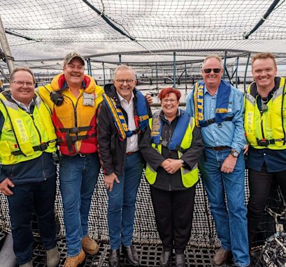 Newly elected Braddon MP Anne Urquhart with Prime Minister Anthony Albanese and salmon industry workers.