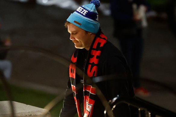 A Bombers fan arrives in a Big Freeze beanie before tonight’s game.