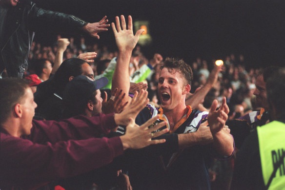 Storm’s Scott Hall celebrates with fans.