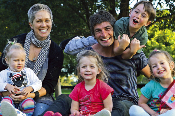 Former Sydney captain Brett Kirk with his family in 2010. Son Indhi (climbing on his dad) is now a father-son prospect.