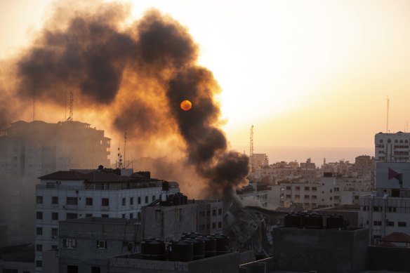 Smoke is seen from a collapsed building after it was hit by Israeli airstrikes on Gaza City on Wednesday. 