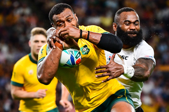 Fiji's Semi Radradra wraps up the Wallabies' Fijian-born centre Samu Kerevi on Saturday.