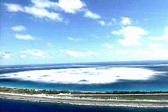 The sea close to the shore of Fangataufa Atoll in French Polynesia turns white following the detonation of an underground French nuclear test in 1995. 