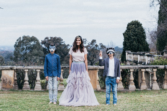 Justine Cullen in her Dries Van Noten birthday skirt, accompanied by two of her sons.