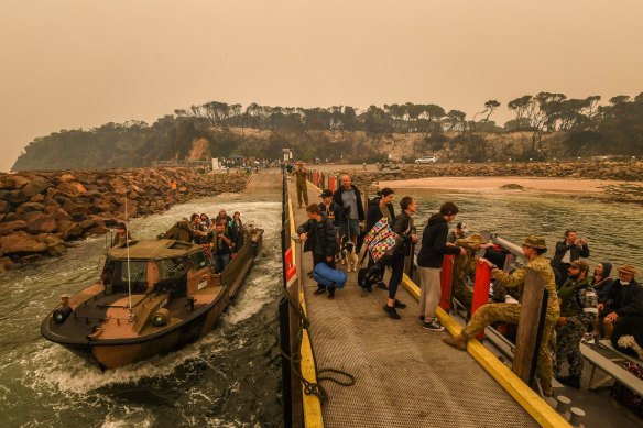 Evacuees prepare to leave Mallacoota on January 3.