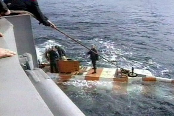 In this video grab provided by the RU-RTR Russian television via APTN , Russia rescue personnel return from a dive in a mini submarine to the Kursk on the sea bed in the Barents Sea.