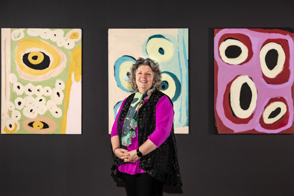 Tarnanthi curator Nici Cumpston with works by Katjarra Butler.