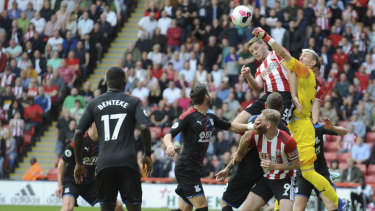 Palace goalkeeper Vicente Guaita punches the ball to keep Sheffield United out at Bramall Lane in Sheffield on Sunday.