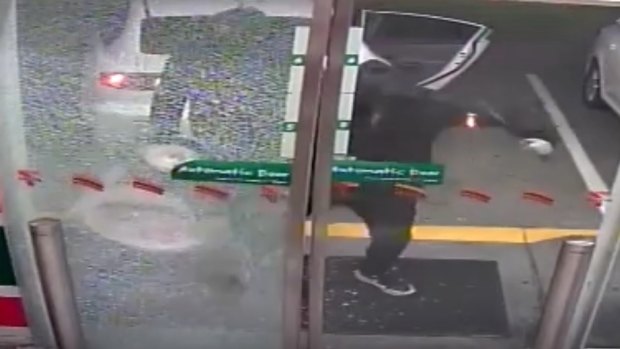 The south-west Brisbane service station being hit by three masked bandits on Friday morning.