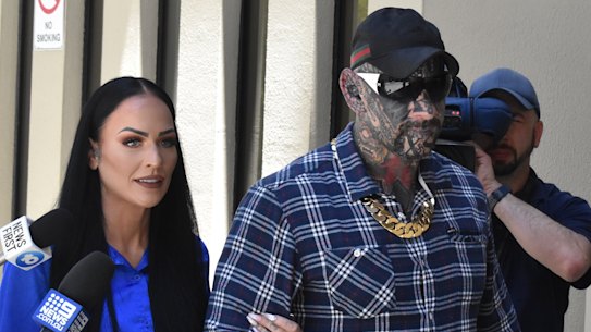 Dayne Brajkovich, supported by his wife, during his December trial.