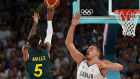 Patty Mills takes a shot against Serbia.