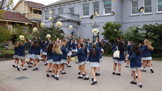 It's not a VCE results day blog unless there is at least one photo of students throwing hats into air. 