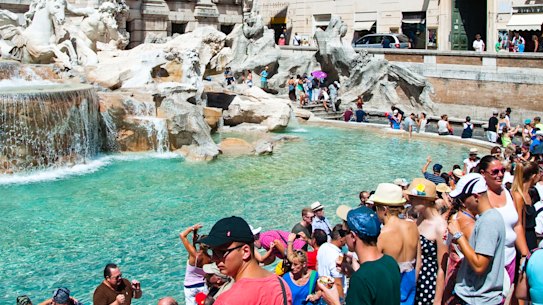  Rome’s Trevi fountain which saw crowds at 6.30am this year.