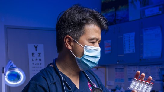 Dr Bernard Shiu prepares to deliver the AstraZeneca COVID-19 vaccine for the first time at the Banksia Medical Centre in Newcomb.