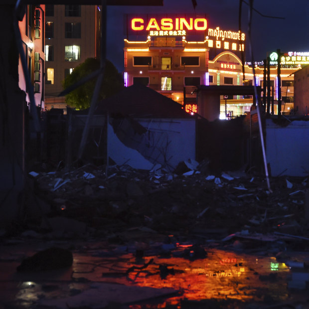 Chinese-funded casinos light up the ruins of an old market in Sihanoukville. 