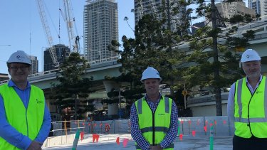 Destination Brisbane project director Simon Crooks, Probuild managing director Jeff Wellburn and Star Casino’s Geoff Hogg walk through the concrete base of The Landing, which will become two landscaped parklands reaching 50 metres out into the Brisbane River.