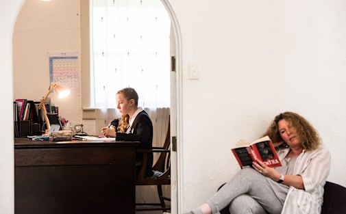 Lara Winsbury in full school uniform trials the online study test by St Andrew's Cathedral School with mum Sally Johnstone close at hand.
