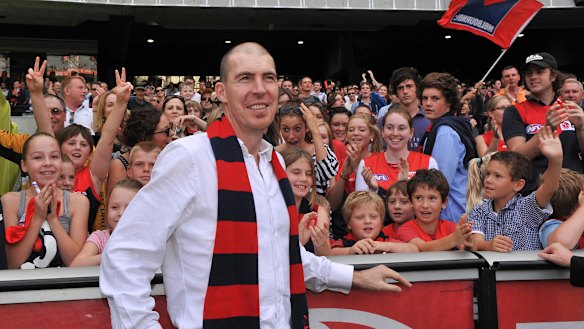 Jim Stynes celebrates a Demons victory with fans in 2010.