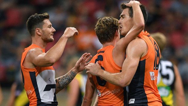 Red-letter day: The Giants congratulate Jeremy Cameron after he added another goal to his tally.