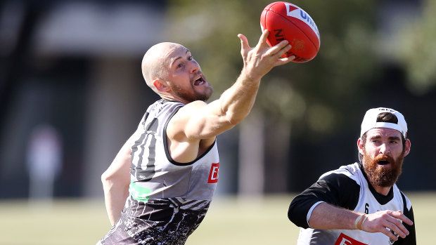 Balancing act: Ben Reid (left) and Tyson Goldsack at a recent Collingwood training session.