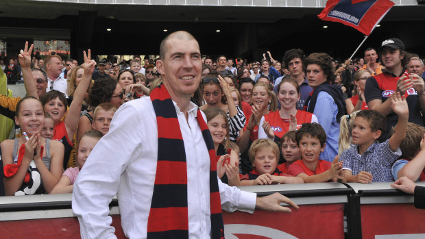 Jim Stynes celebrates a Demons victory with fans in 2010.